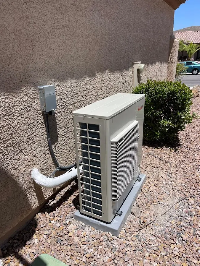 Residential air conditioning condenser unit in Clive