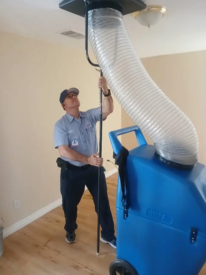 HVAC Installation technician using HEPA equipment in Clive